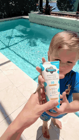 A real customer with their HolyCow's Wildara Sunscreen by the pool